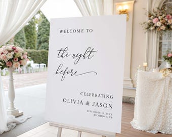 May include: A white sign on an easel with the text "WELCOME TO the night before CELEBRATING OLIVIA & JASON SEPTEMBER 15, 20XX RICHMOND, VA" in black script. The sign is at a wedding venue with floral arrangements and draped fabric.