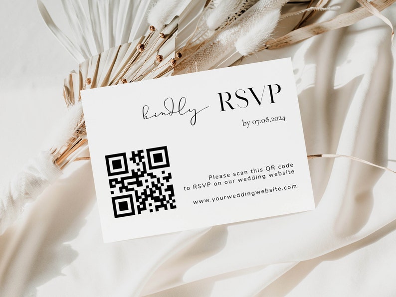 May include: A white RSVP card with a black and white QR code. The text on the card reads "Kindly RSVP by 07.08.2024. Please scan this QR code to RSVP on our wedding website www.yourweddingwebsite.com"