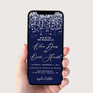 May include: A navy blue wedding invitation with silver glitter. The invitation reads "Join us for the wedding of Olivia Davis and Oscar Howard, Saturday, December 15, 2022, at half past two o'clock in the afternoon, Best Restaurant, 74 Thorne Street, Kingston, NY, reception to follow."