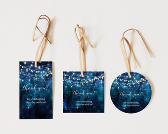 May include: Three different thank you tags with a blue galaxy background and white string lights. The text on the tags reads "thank you! for celebrating this day with us!"