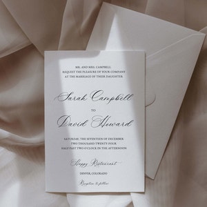 May include: A white wedding invitation card with black text announcing the marriage of Sarah Campbell to David Howard. The wedding will take place on Saturday, December 17, 2024 at 2:30 PM at Happy Restaurant in Denver, Colorado.