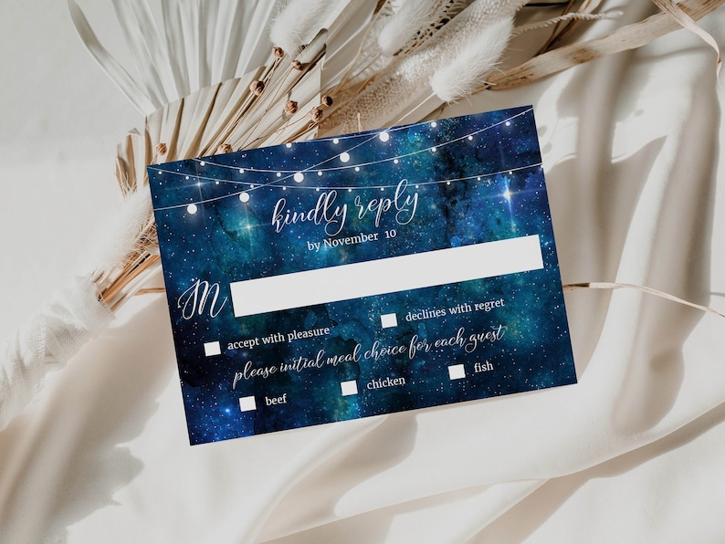 May include: A blue and white RSVP card with a starry night sky background and string lights. The text reads "kindly reply by November 10". There are checkboxes for accepting or declining the invitation and for choosing a meal option: beef, chicken, or fish.