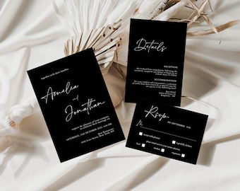 May include: Black and white wedding invitation suite with calligraphy font. The invitation card reads "Amelia and Jonathan" with the date and time of the wedding. The details card includes information about the reception and accommodation. The RSVP card has a checkbox for guests to indicate their attendance.