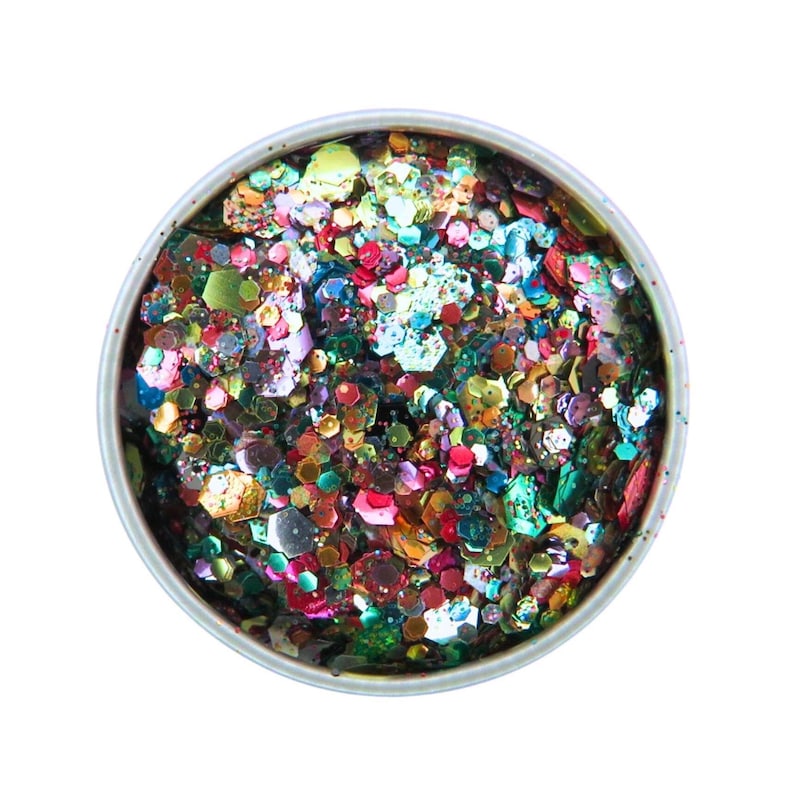May include: A round container filled with colorful glitter. The glitter pieces are various shapes and sizes, including hexagons and irregular forms. The colors include red, green, blue, gold, and purple, creating a vibrant, multi-colored effect.