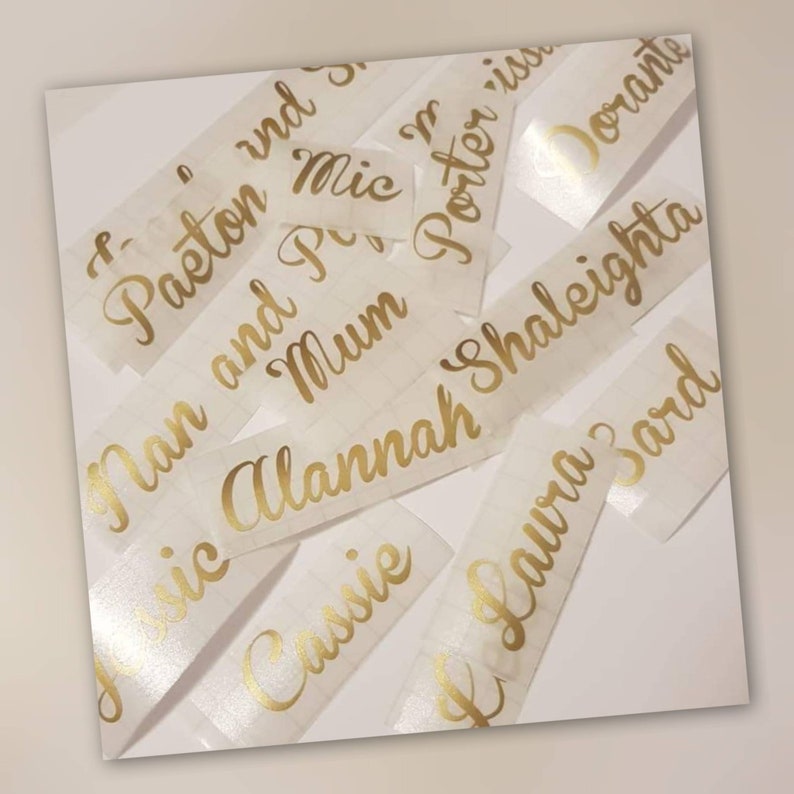 gold wording on white background
gold vinyl lettering any wording as a vinyl decal, australian seller