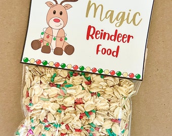May include: A clear plastic bag filled with a mixture of oats and colorful sprinkles. The bag has a label that says "Magic Reindeer Food" with a cartoon reindeer wearing Christmas lights.