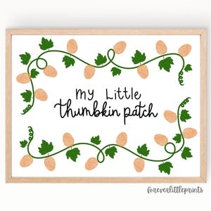 May include: A framed print with the text "my Little thumbkin patch" in black script. The artwork features a white background with a decorative border of green vines, leaves, and light orange thumbprints. The frame is a light wood color.