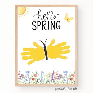May include: A printable art print featuring a yellow butterfly created using handprints, a sun, and the text "hello spring". The butterfly is surrounded by a border of watercolour flowers.