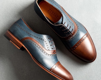 Zapatos Oxford Eryx de cuero pintado a mano en azul marino y marrón con punta y costura Blake para hombre