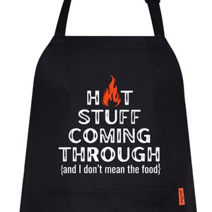 May include: Black apron with white text that reads "Hot Stuff Coming Through {and I don't mean the food}". The text is in a distressed font and features a small orange flame graphic.