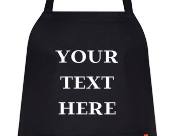 May include: Black apron with a white pocket and the text "YOUR TEXT HERE" printed on the front.