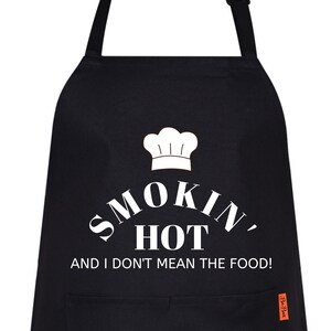 May include: Black apron with a white chef's hat and the text "Smokin' Hot and I don't mean the food!"
