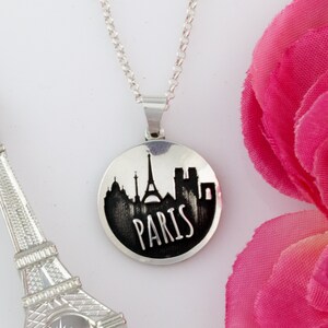 City skyline round necklace laser engraved with city outline of your choice in sterling silver - personalized travel jewelry