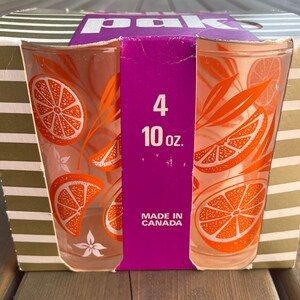 May include: A package of four 10-ounce orange juice glasses with an orange slice design. The glasses are made in Canada.