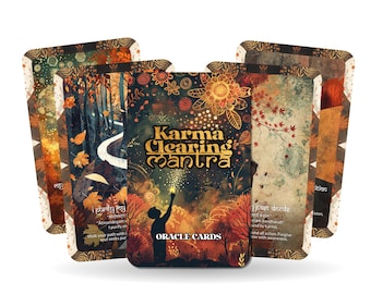 May include: A deck of "Karma Clearing Mantra" oracle cards. The cards feature autumnal illustrations with a central card displaying the title in gold lettering and a silhouette of a person reaching towards a light. The deck is designed with warm colors.