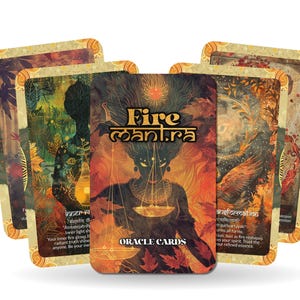 May include: A deck of Fire Mantra Oracle Cards. The cards feature illustrations with a warm color palette, including orange, brown, and gold. The central card displays a figure with a scale, and the deck is labeled "Oracle Cards".