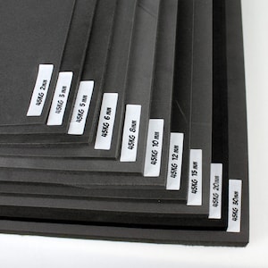 May include: A stack of black foam sheets with labels indicating different thicknesses in millimetres, ranging from 2 mm to 30 mm.