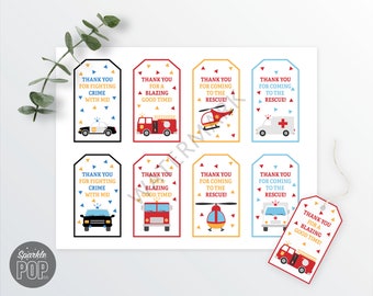 May include: Eight printable thank you tags featuring a variety of emergency vehicles, including a police car, fire truck, ambulance, and helicopter. The tags are decorated with red, yellow, and blue confetti and feature the text "Thank you for fighting crime with me!" or "Thank you for a blazing good time!" or "Thank you for coming to the rescue!"