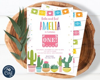 May include: A colorful 5" x 7" invitation with a fiesta theme. The design features the name "Amelia" in rainbow colors, cactus illustrations, and the text "fiesta and fun!" and "ONE!" The invitation includes event details.