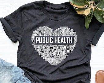 May include: Black t-shirt with a white heart-shaped design featuring the words "PUBLIC HEALTH" surrounded by related terms like "infectious disease", "prevention", and "statistics".