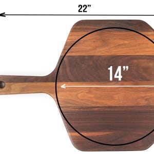 a wooden cutting board with measurements drawn on it, indicating the dimensions of the board in inches.