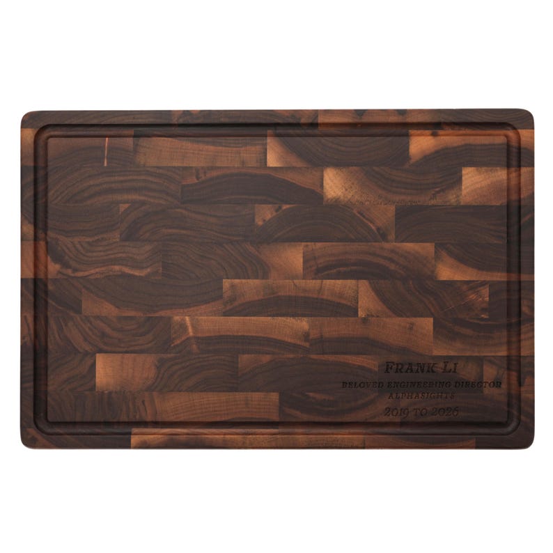 a wooden cutting board with a dark brown, textured surface.