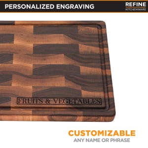 a wooden cutting board with a personalized engraving on it.