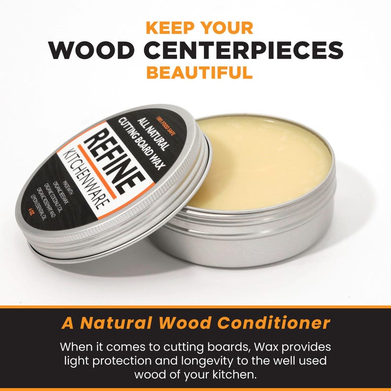 May include: A silver tin of Refine Kitchenware cutting board wax, with the lid slightly ajar. The label states "All Natural Cutting Board Wax" and "Made with Organic Coconut Oil". The wax inside is a pale yellow. Text at the top reads "Keep Your Wood Centerpieces Beautiful".