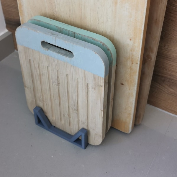 Chopping board holder/stand. Minimalist design to de-clutter worktop.