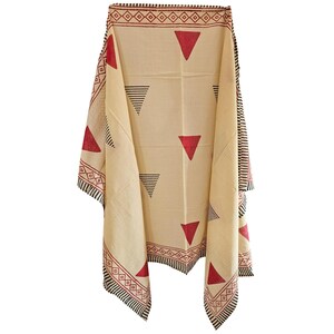 May include: Cream-colored textile with a geometric pattern. The design features red triangles and black triangles, along with a border of red and black geometric shapes. The textile is draped, showcasing its design.