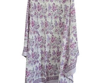 May include: A white cotton scarf with a purple floral print. The scarf has a border with a repeating pattern.