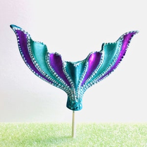 Large edible fondant shimmery mermaid tail under the sea cake decoration