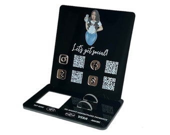 May include: Black acrylic stand with a white graphic of a woman and the text "Let's get social!" with social media icons and QR codes. The stand also has a white graphic with the text "We accept contactless payments VISA AMEX" and a black rectangle with the text "Tap Here"