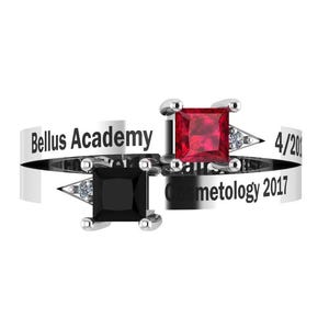 May include: A silver ring with two square gemstones, one black and one red. The ring has the text "Bellus Academy" and "Cosmetology 2017" engraved on it. Small diamonds are set near the gemstones.