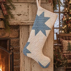 May include: A quilted Christmas stocking featuring a white fabric base with small multicolored dots and large blue star appliques. The stocking has a matching fabric loop at the top for hanging and is constructed with visible stitching throughout.