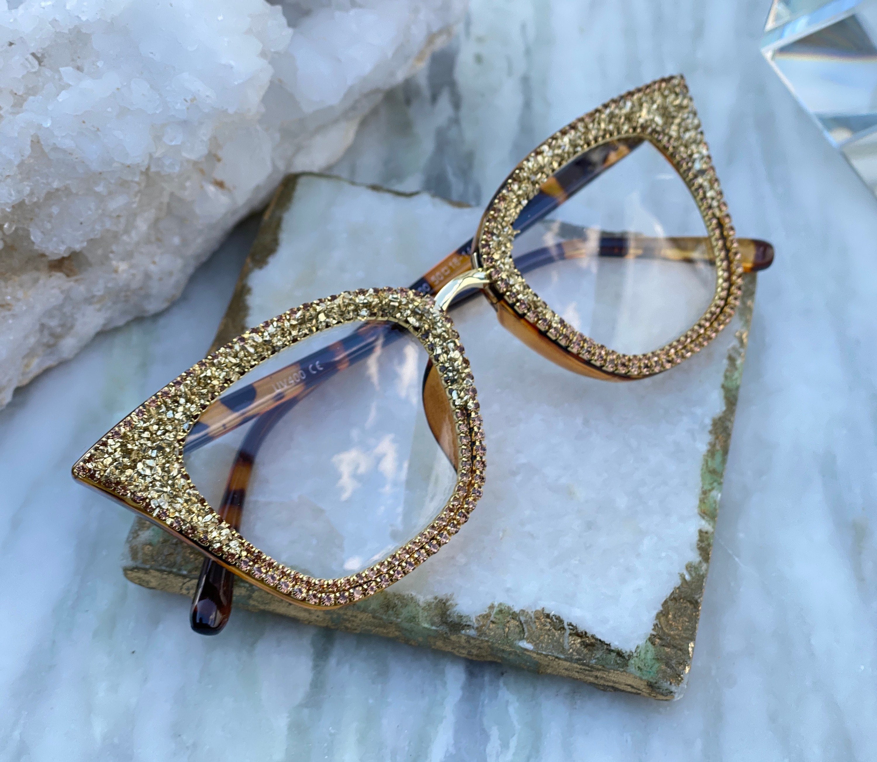 Sunglasses cat-eye style with silver frame and crystals