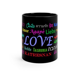 May include: Black coffee mug with the word "LOVE" in large, blue letters surrounded by the word "love" in various languages, including Spanish, French, German, Hebrew, Arabic, and Hindi.