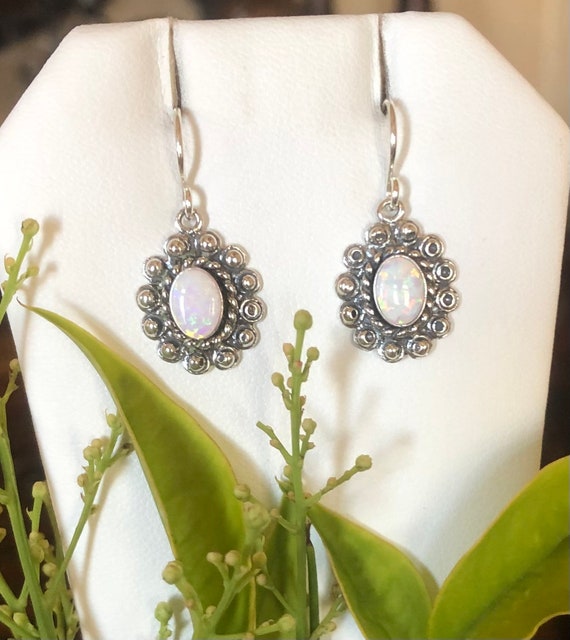Sterling Silver 5x7mm Oval Created White Opal Post Earrings Sterling Silver 5x7mm Oval Created White Opal Post Earrings