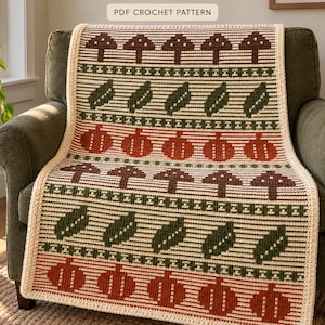 Peut inclure: Une couverture au crochet avec un motif répétitif de champignons marron, de feuilles vertes et de citrouilles orange sur fond crème. La couverture a une bordure crème et inclut le texte PDF CROCHET PATTERN en haut.