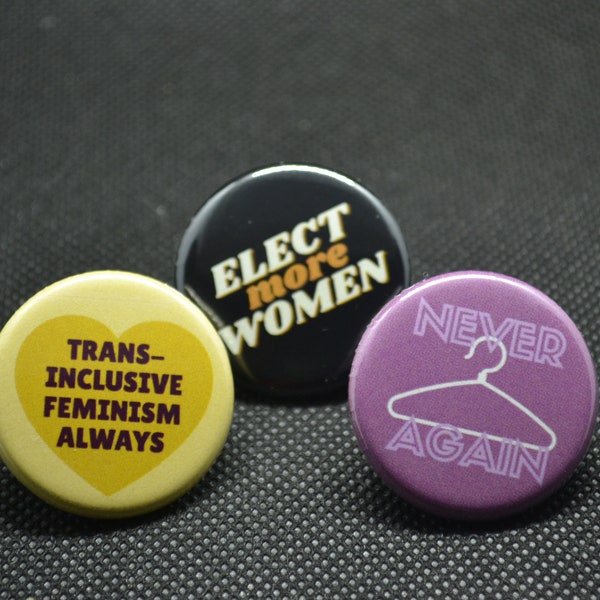 abortion rights button, never again button, elect more women button, trans inclusive feminism button, trans inclusive pin, feminist pin