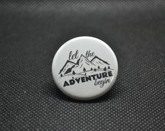 Let the adventure begin button, environmentalist buttons, camping buttons, nature buttons, mountain pin, nature pin, camping pin