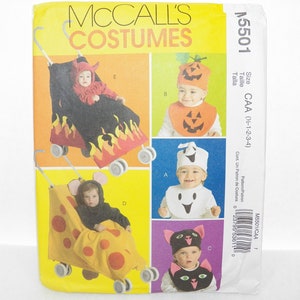 May include: McCall's Costumes sewing pattern for babies. The pattern includes instructions for making various Halloween costumes, including a devil, pumpkin, ghost, mouse, and cat. The pattern size is CAA (1/2-1-2-3-4).