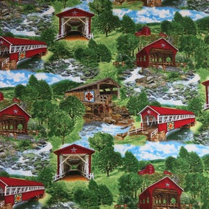 May include: Fabric with a repeating pattern of red covered bridges, barns, and flowing streams. The bridges have white accents and star details. Lush green trees and blue skies fill the background, creating a scenic, rural theme.