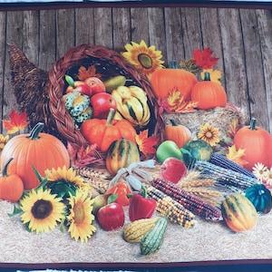 May include: A fall-themed image featuring a cornucopia overflowing with pumpkins, gourds, apples, and ears of corn. Sunflowers and autumn leaves are scattered around the cornucopia, creating a harvest scene. The background is a wooden plank design.