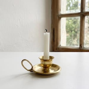 Vintage Polished Brass Chamberstick Taper Candle Holder with Prongs for Glass Insert and Loop Handle. Surface Wear Present.