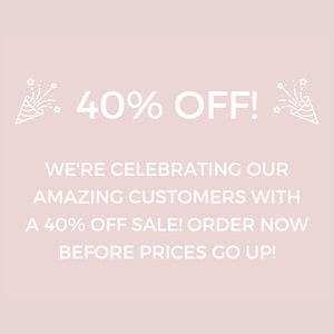 May include: A light pink background with white text announcing a 40% off sale. The text includes "40% OFF!" and "WE'RE CELEBRATING OUR AMAZING CUSTOMERS WITH A 40% OFF SALE! ORDER NOW BEFORE PRICES GO UP!"