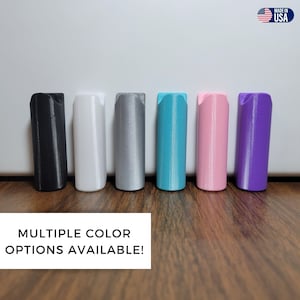 May include: Six different color options for a 3D printed wall mount. The colors are black, white, silver, teal, pink, and purple.  Multiple Color Options Available!