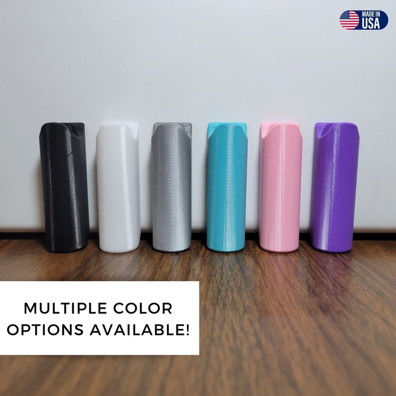 May include: Six different color options for a 3D printed wall mount. The colors are black, white, silver, teal, pink, and purple.  Multiple Color Options Available!