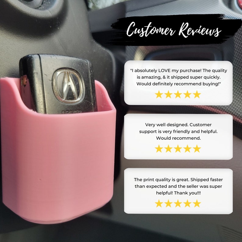 May include: A pink car key holder with a key inside, mounted on a car's dashboard. The image includes customer reviews with star ratings and the text "Customer Reviews."