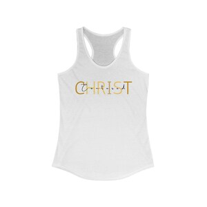 May include: White tank top with a gold graphic that says "Centered" and "CHRIST" in a gold script font.